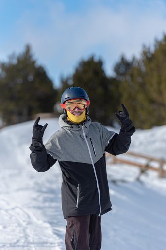 A young Spanish snowboarder on the slopes of a ski resort in Grandvalira, Andorra