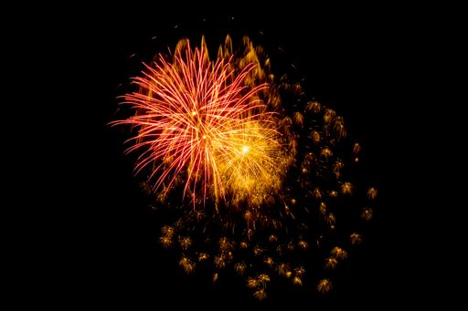 bright rays of New Year's fireworks on a black background of the night sky.