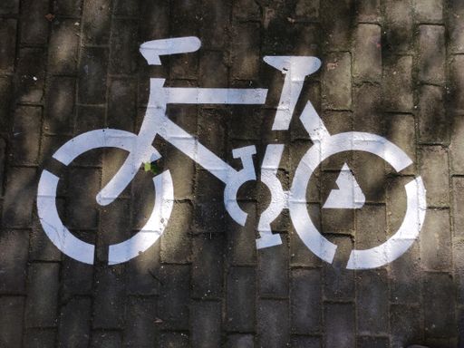 A top shot of a bicycle symbol on the street path.