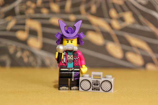 A closeup shot of a LEGO Samurapper figure with a boombox