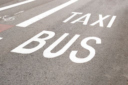 The detail of a taxi bus lane with a cycle lane on the left