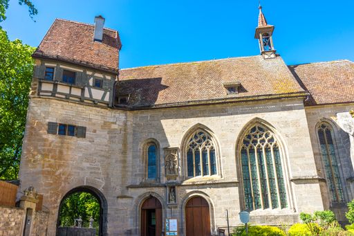 An exterior of the St. Wolfgang's Fortress Church in Rothenburg ob der Tauber against blue sky