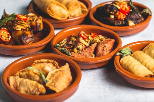 An assortment of tasty and appetizing dishes in clay bowls