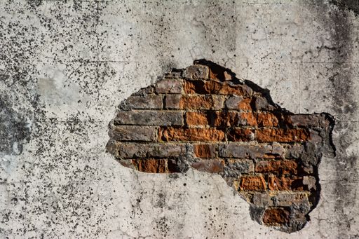 A closeup of an old rusty wall