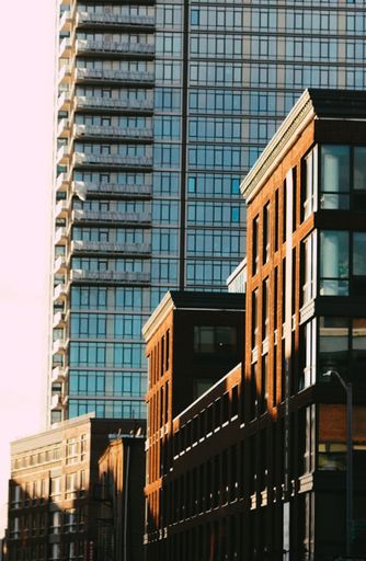 A vertical shot of beautiful buildings shining under the sunrays - great for wallpapers