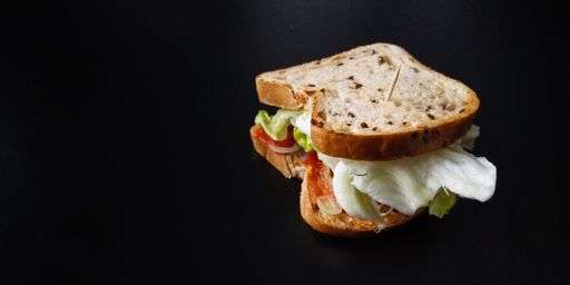 A closeup shot of a sandwich isolated in a black background