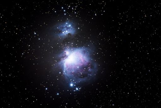 A beautiful shot of the Orion Nebula in the dark starry night sky