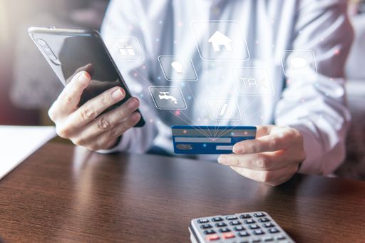 Woman using smartphone with credit card, ordering online shopping. Working from home concept, virtual screen, copy space