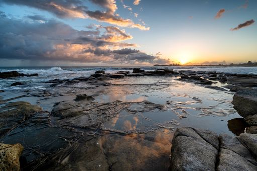 A mesmerizing view of a golden sunrise on the coast of Queensland, Australia
