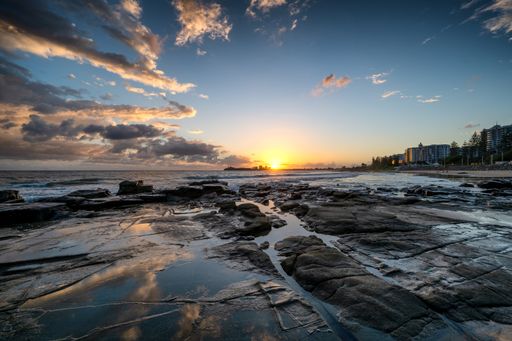 A mesmerizing view of a golden sunrise on the coast of Queensland, Australia