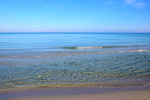 Sandy beach and crystalline water in Salento, Italy