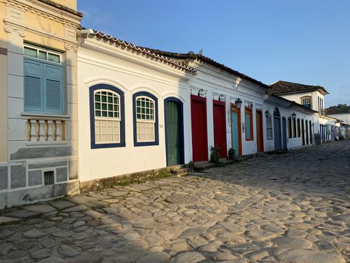A building with green and red doors during daytime