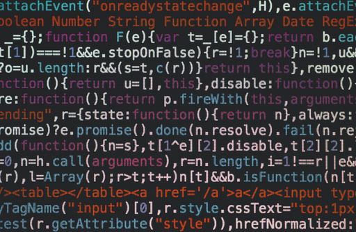 A selective closeup shot of data codes on a computer monitor screen