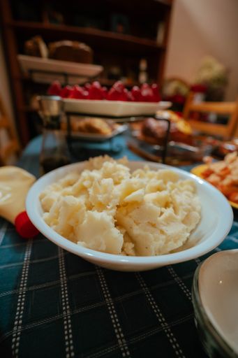 A shallow focus of mashed potatoes on a white plate, Xmas celebration