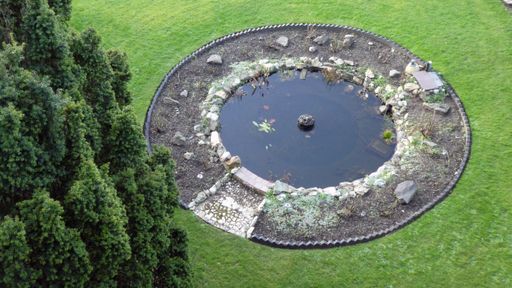 A top view of a circular fountain in a park