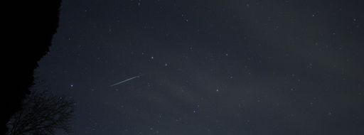 A falling star in the night sky