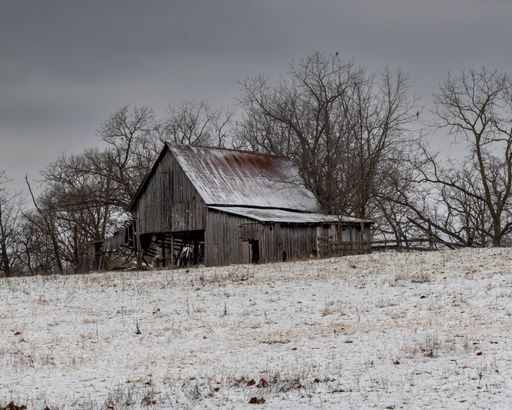 An old wooden barn in winter