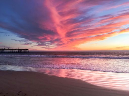 The breathtaking sunset above the sea. Pismo Beach, California.