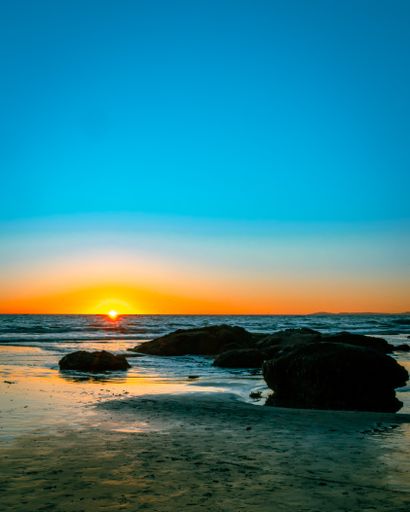 A vertical shot of the Pacific Ocean at the beautiful sunset in San Clemente, California