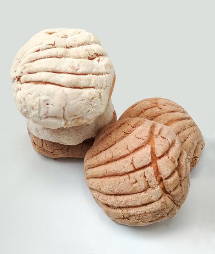 The close-up shot of the traditional Mexican bread shells isolated on a white background