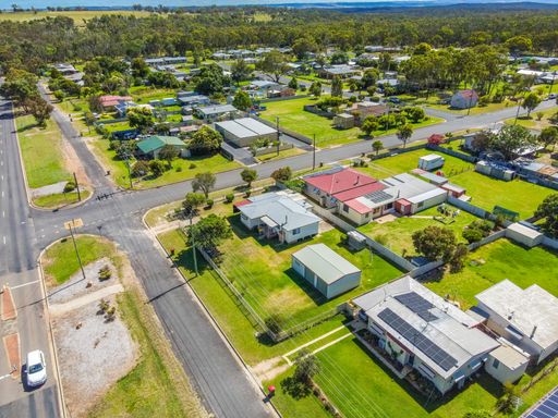 An Aerial View of the town of Gilgai surrounded by green rainforests in Australia