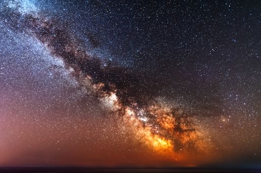 A galactic center of the milky way with many colors on a starry sky in deep space