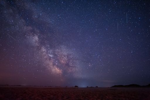 A galactic center of the milky way with many colors on a starry sky in deep space