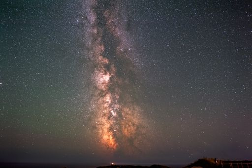 A galactic center of the milky way with many colors on a starry sky in deep space