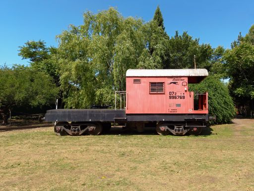 old wooden red caboose. Railroad car used at the end of trains to transport crew. Argentine Railways. Ferroclub workshops.