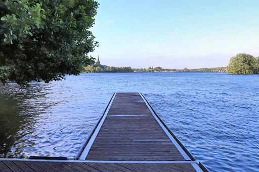 An amazing view at a northern german lake on a sunny day with nice blue water and relaxing landscapes