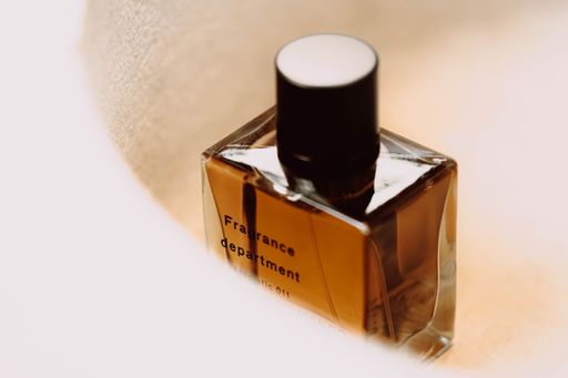 A closeup shot of a luxurious glass perfume bottle