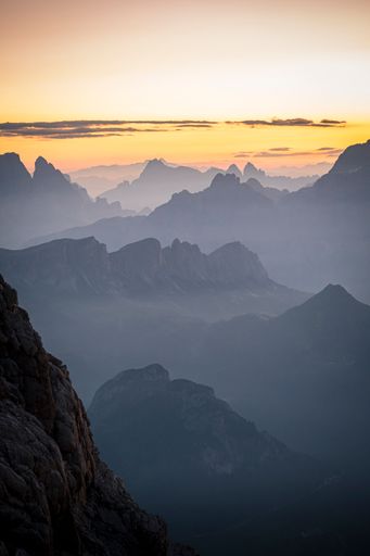 A vertical shot of morning silhouettes of the Dolomites, Italy
