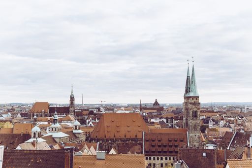 An aerial shot of buildings near each other under a cloudy sky in Nuremberg