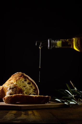 A beautiful shot of a fresh baked bread and an olive oil