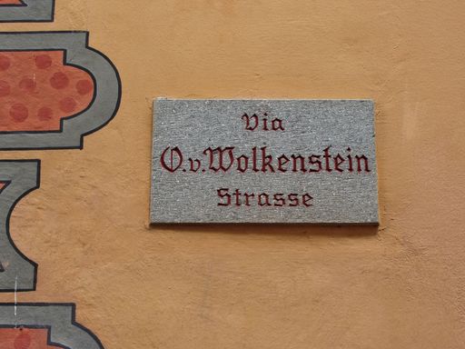 Signboard with name of the street in the center of Castelrotto (Kastelruth) Alpe di Siusi , Dolomites mountains