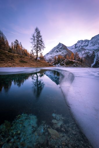 Autumn sunrise at the Arolla Lac Bleu in Valais, Switzerland