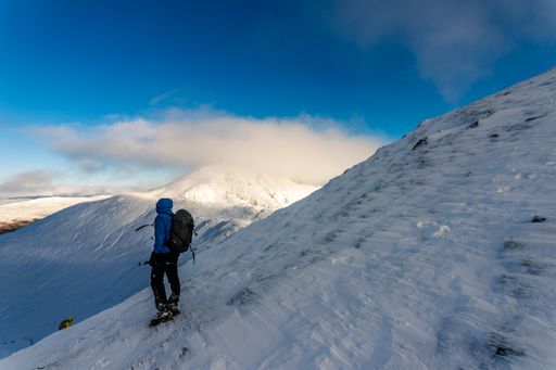 A hiker on the highlands in Scotland