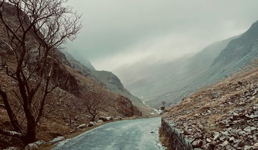 A beautiful view of a winding road a winding road passing through rocky hills