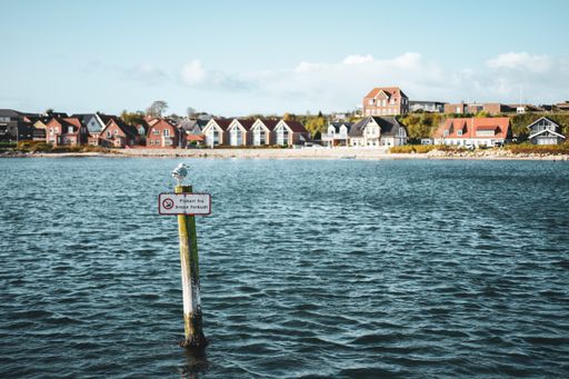 A wooden sign near the harbor in Sonderborg, Denmark