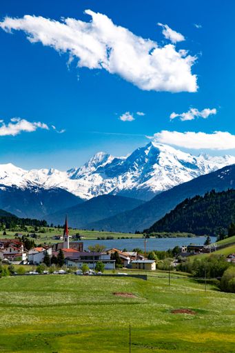 An aerial shot of a beautiful field on a sunny day in Sudtirol, Italy