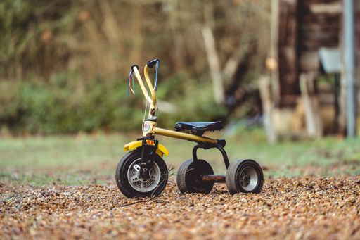 A closeup of a small bicycle on the ground