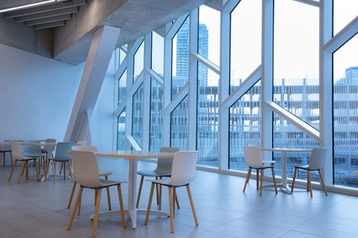 A clean, white seating area in Central Library with a city view in Calgary, Alberta, Canada