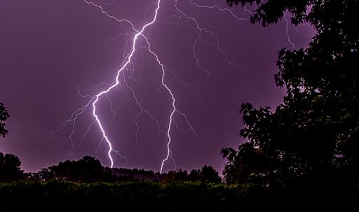 A beautiful shot of lightning in purple sky