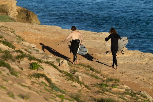 The surfers with surfing boards in Western Australia