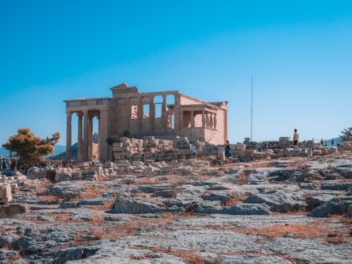 The Erechtheion temple with Caryatid Porch on the Acropolis, Athens, Greece under a clear blue sky