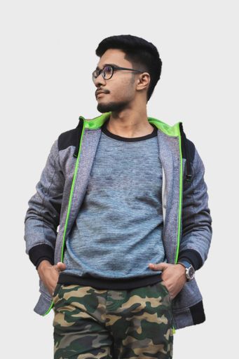 A portrait of a man looking sideways with hands in pocket. Isolated Background.