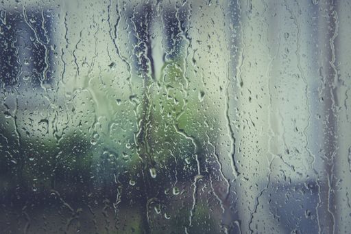 A window covered in raindrops after the heavy rain in the evening