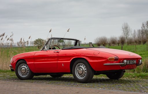 A red vintage car Alfa Romeo1750 Spider Duetto manufactured in the year 1969