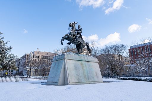 The equestrian statue of Andrew Jackson in Lafayette Park covered in snow.