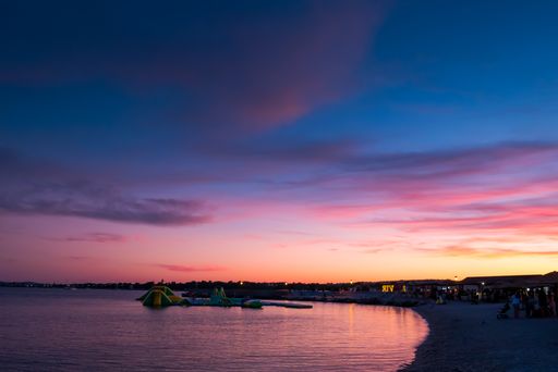 A landscape of a beach surrounded by the sea during the sunset in Vir, Croatia